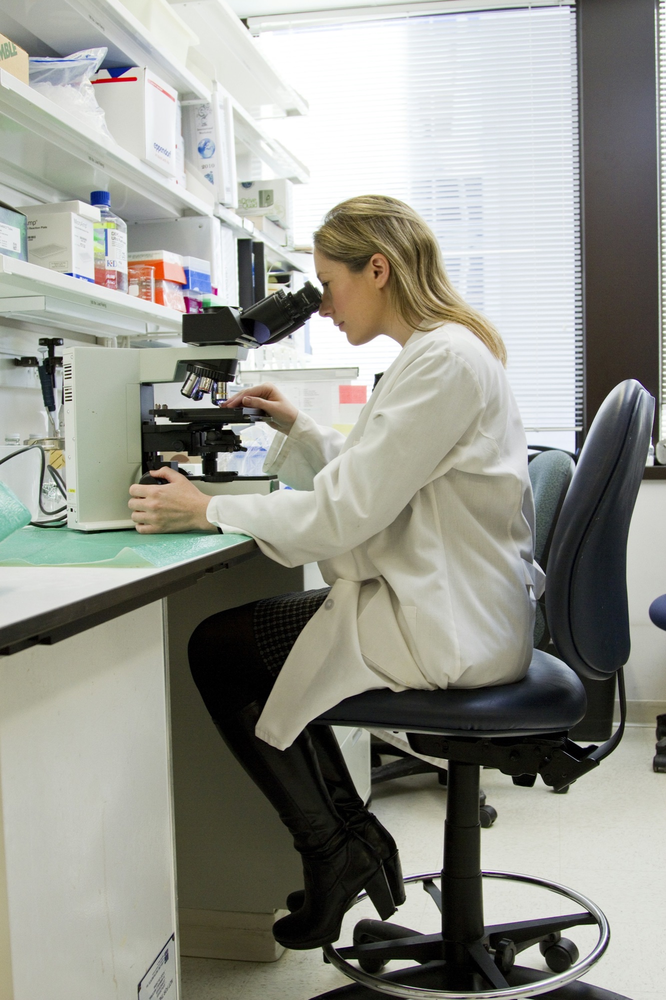 Laboratory analyst at microscope — Environmental Labworks bench work
